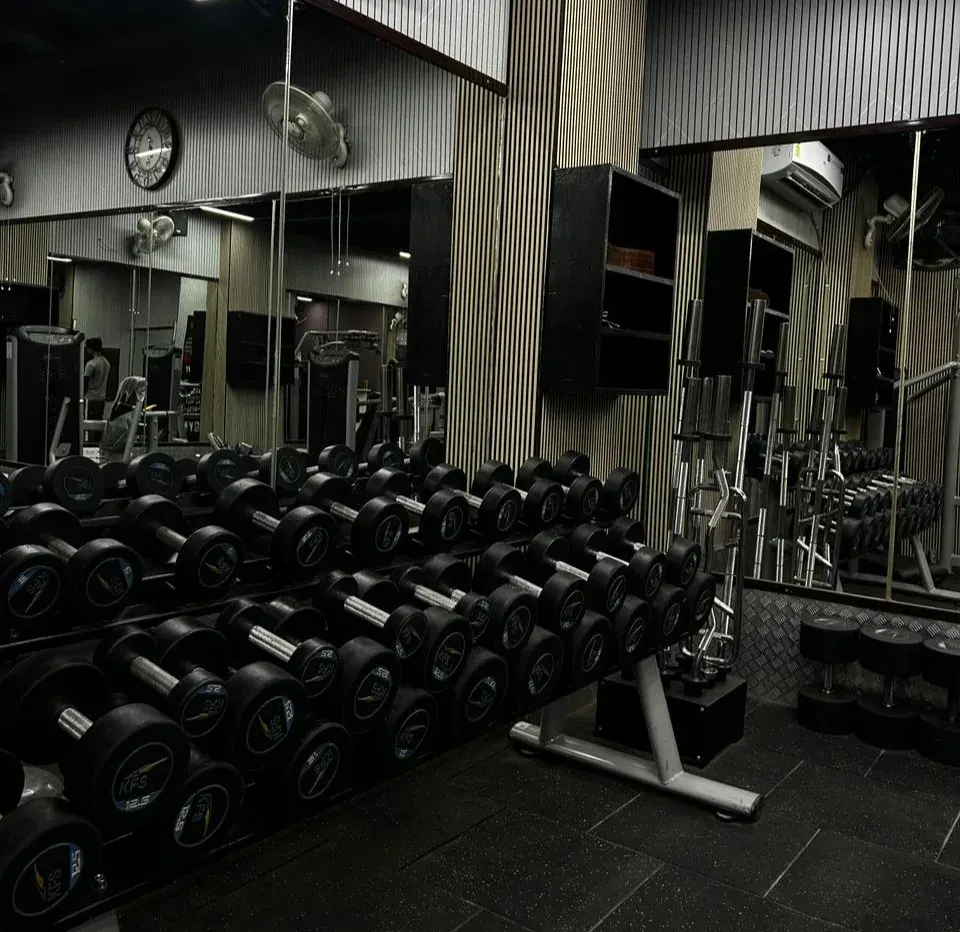 Gym interior with dumbbell area at The Fitness Factory Vasundhara